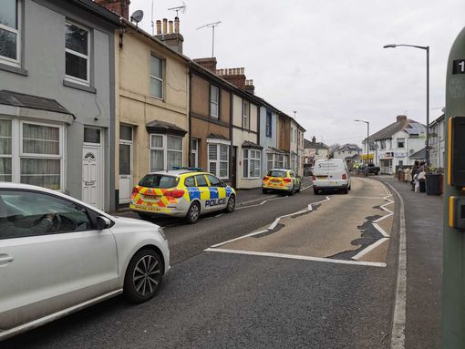 Two more cars were positioned further down the street