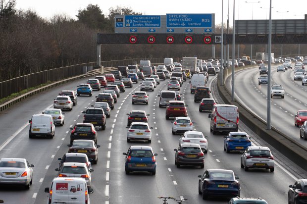 a busy highway with a sign that says south west