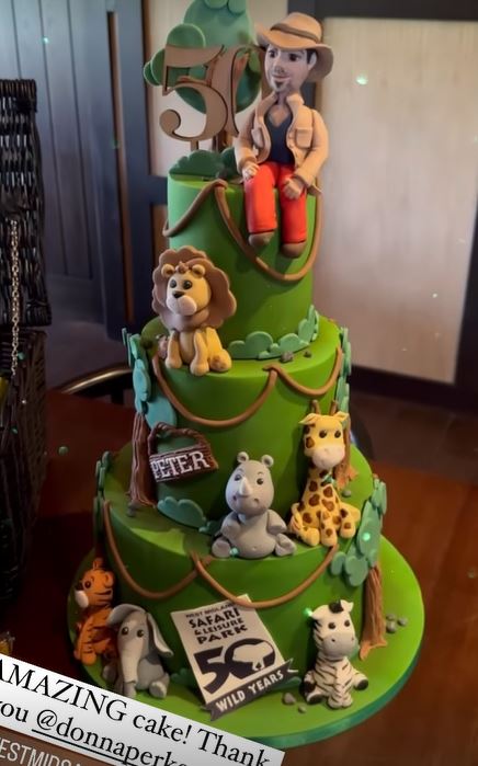 She took to Instagram with a snap of the three-tiered cake