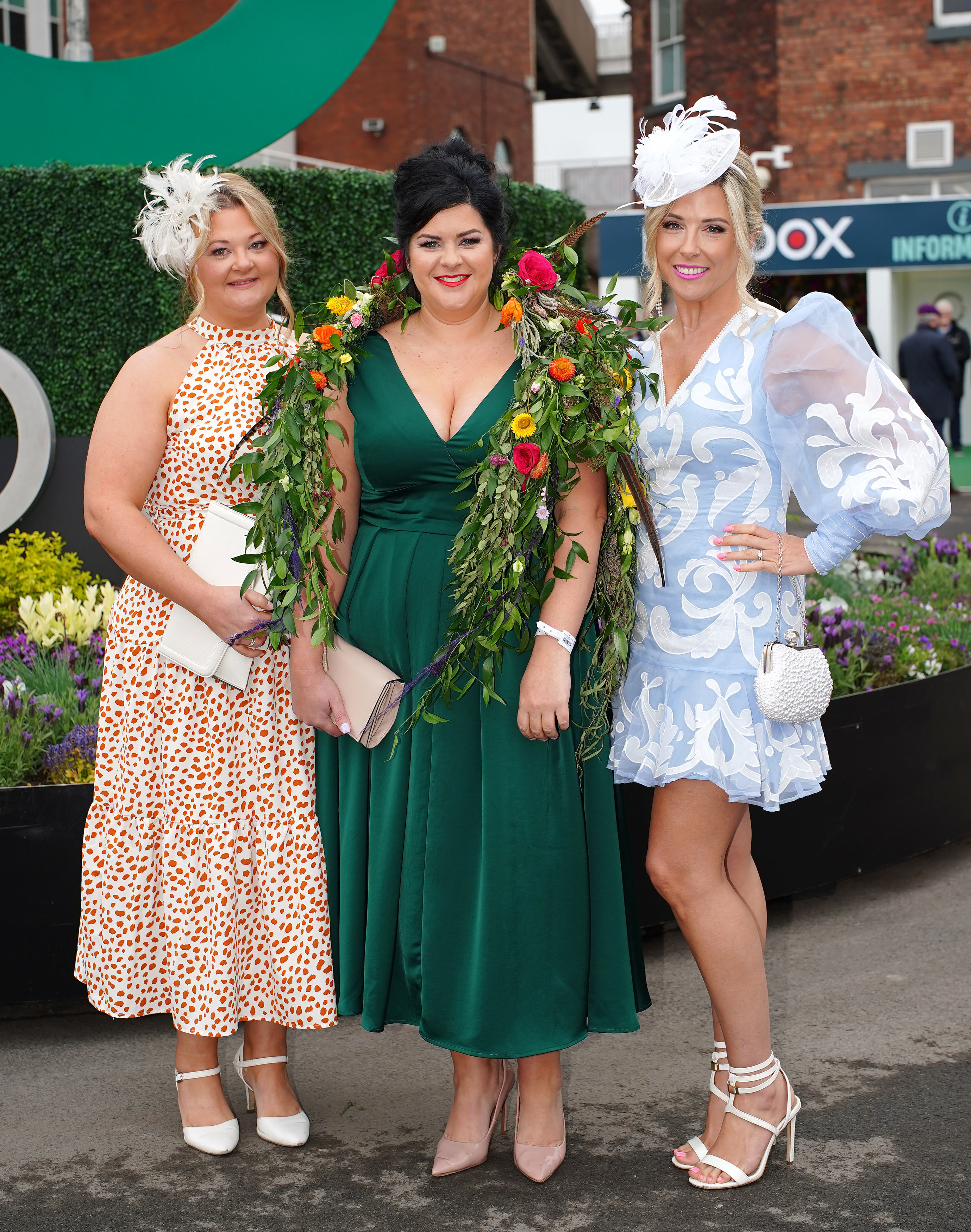 Chic guests Gemma Slater, Charlotte Graham and Amanda Warnock pose for day two of the Randox Grand National Festival