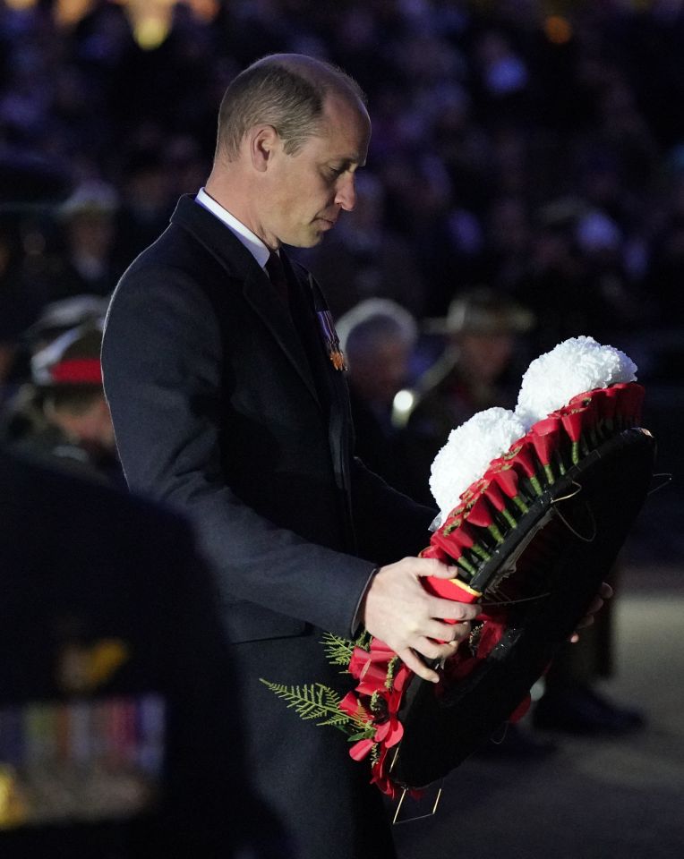 The Prince of Wales lays a wreath at the Anzac Day dawn service