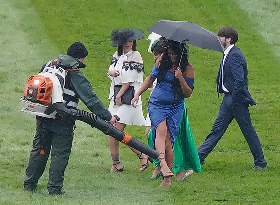 A woman had her feet dried by a leaf blower