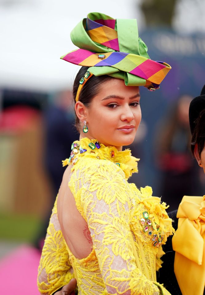 There was no missing this bright headpiece and bejewelled gown at the racecourse