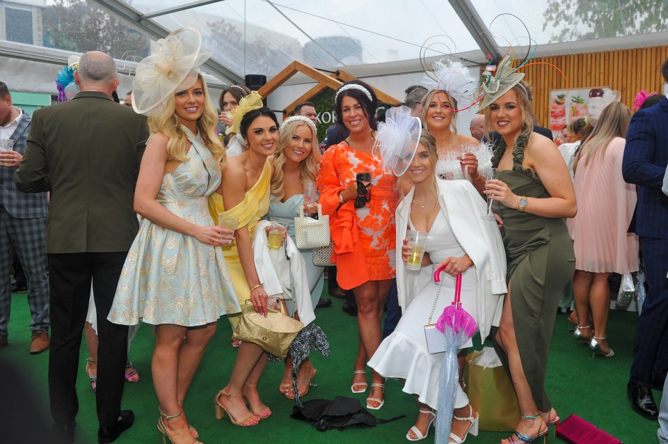 Women have defied the wind and rain to have fun at the races