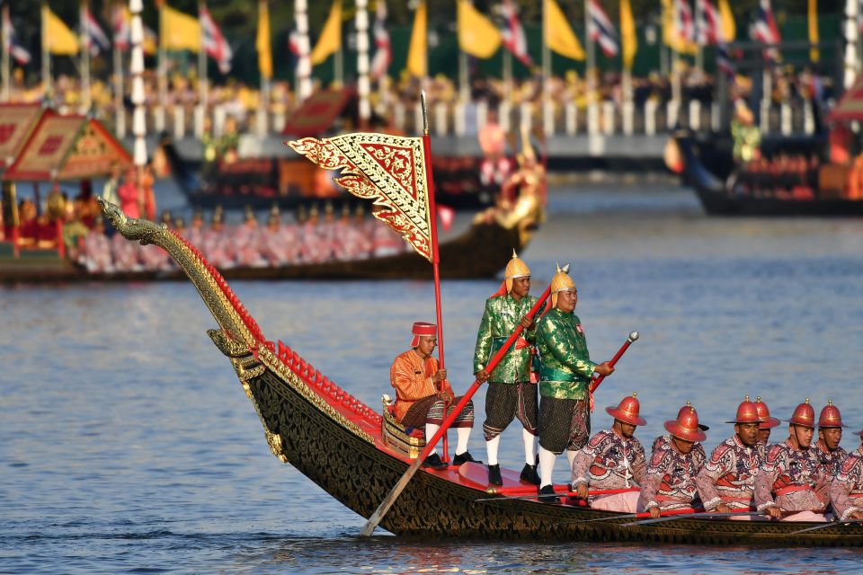 Thai oarsmen row during the royal barge procession along the Chao Phraya river in Bangkok in 2019