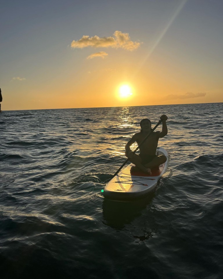 The family headed out on boards into the ocean