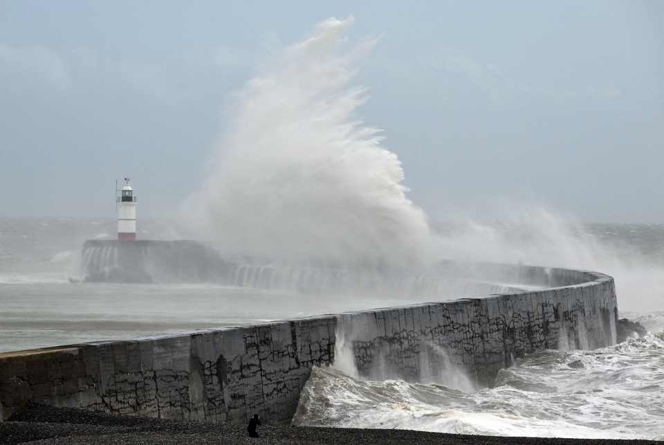 Storm Noa batters the south coast as waves break over Newhaven Lighthouse today