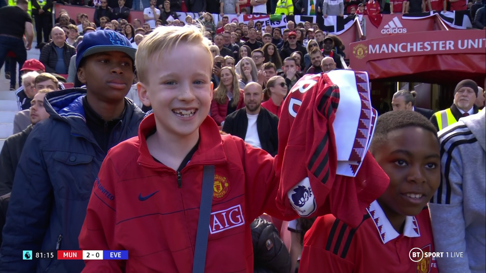 One young fan looked on top of the world as he held Rashford's shirt