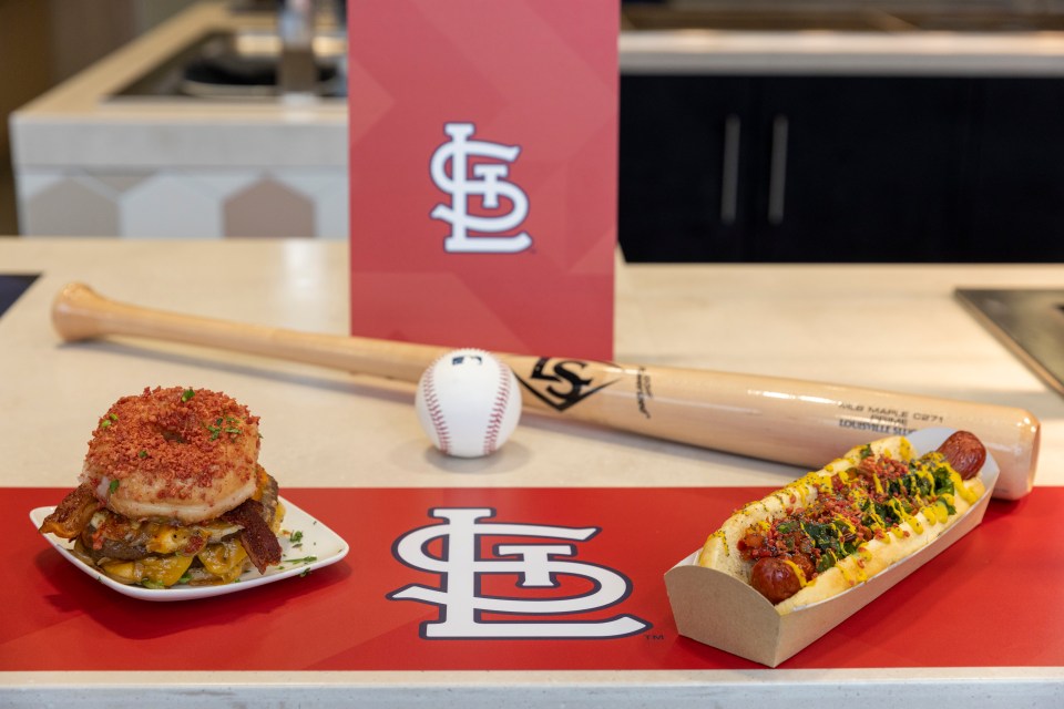 The menu features St Louis-themed dishes such as a donut burger and a bacon-stuffed hotdog