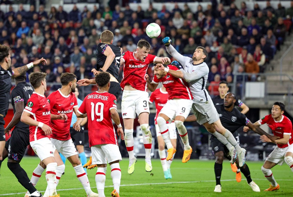 AZ Alkmaar goalkeeper Mat Ryan punches clear to safety