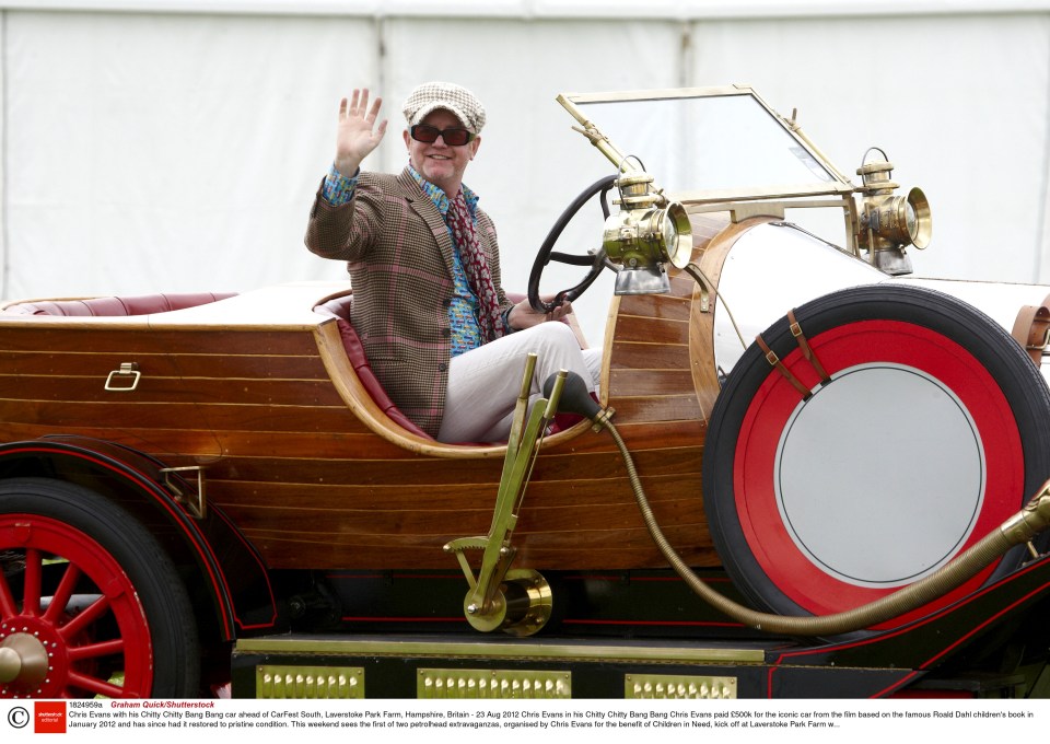 Chris Evans posed in his Chitty Chitty Bang Bang car ahead of CarFest South at Laverstoke Park Farm in Hampshire, in August 2012.