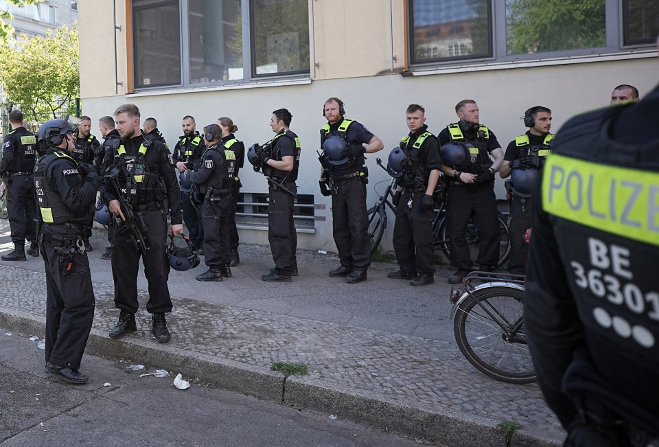 Police stand outside the Protestant School Neukoelln in Berlin