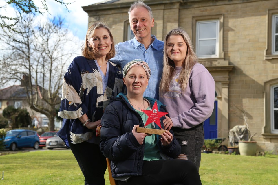 Laura Nuttal with her family last month after receiving the Special Recognition Award from The Brain Tumour Charity