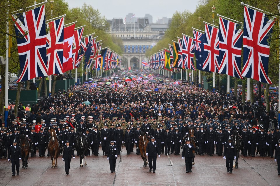 The crowds are taken along the Mall to Buckingham Palace