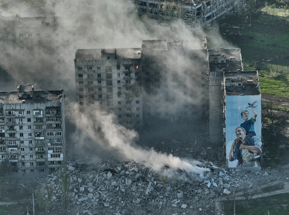 Smoke rises from a destroyed building in Bakhmut