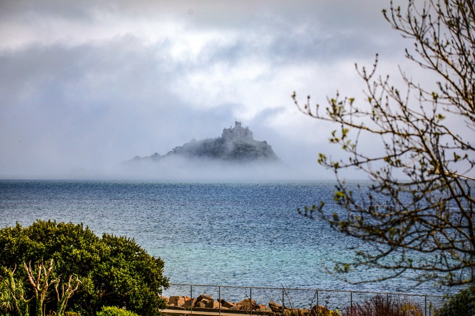 Tuesday will be largely clear but unsettled weather, like here in St Michael's Mount, Cornwall, is set to arrive later in the week