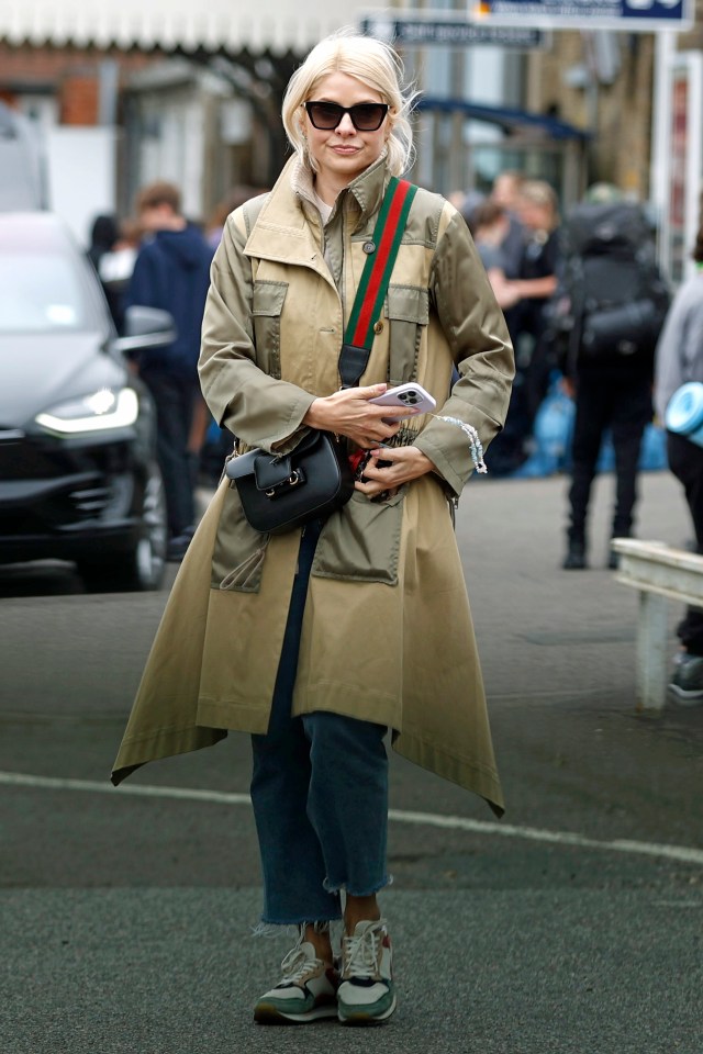 Holly sported a camel coloured trench coat, shades and jeans for the outing