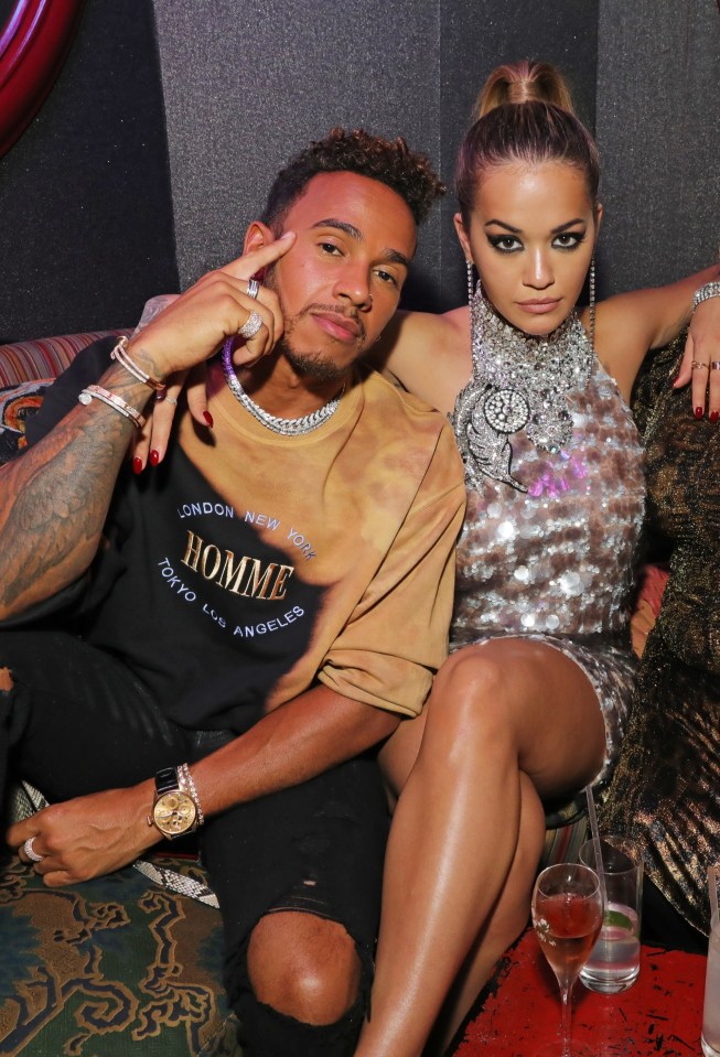 Lewis Hamilton and Rita Ora at a party.