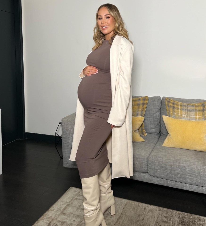 Kate Ferdinand showed off her growing baby bump in a brown midi dress