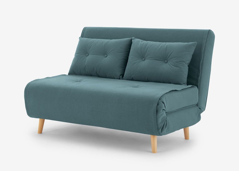  With its lux fabric and pine frame, this sofa bed looks more expensive than it is