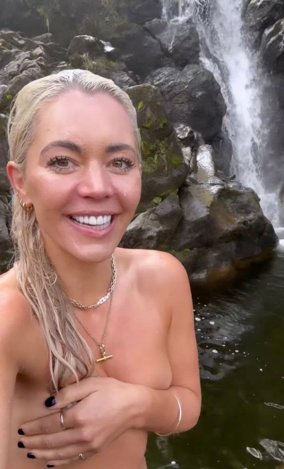 Danni displayed her daring side by leaping into the gushing waterfall topless