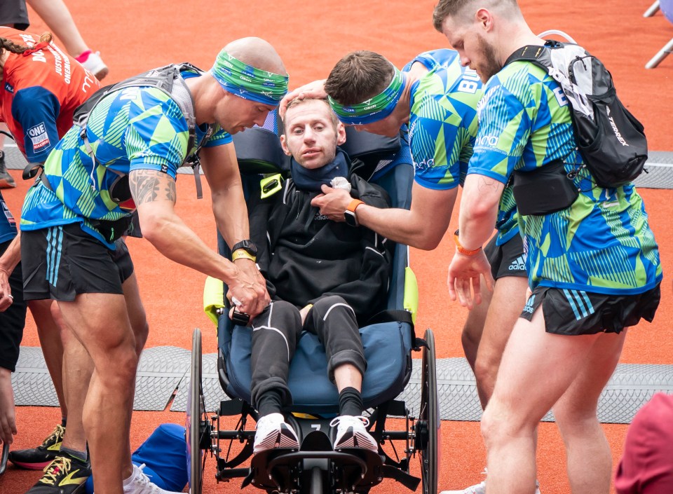 Rob crossing a finishing line at the Leeds Marathon with his pals