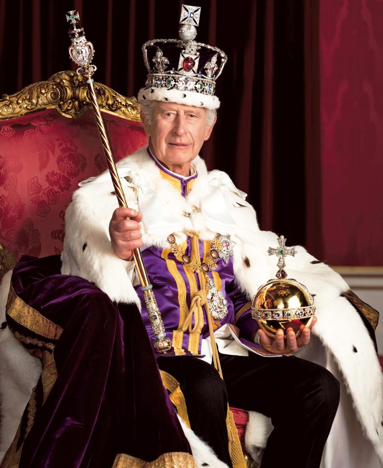 The King is pictured in full regalia wearing The Robe of Estate and the Imperial State Crown