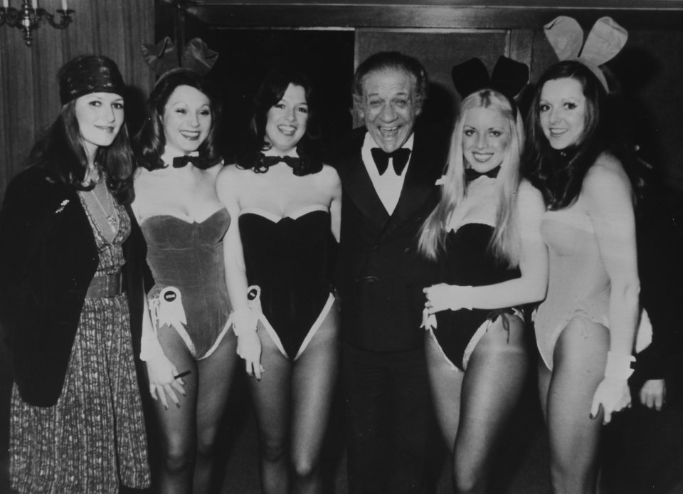 Eve, second right, with Sid James and fellow Playboy Club waitresses