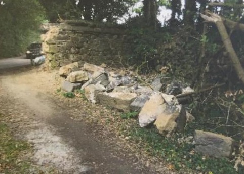 Rubble remaining where the entrance gate pillar was knocked down