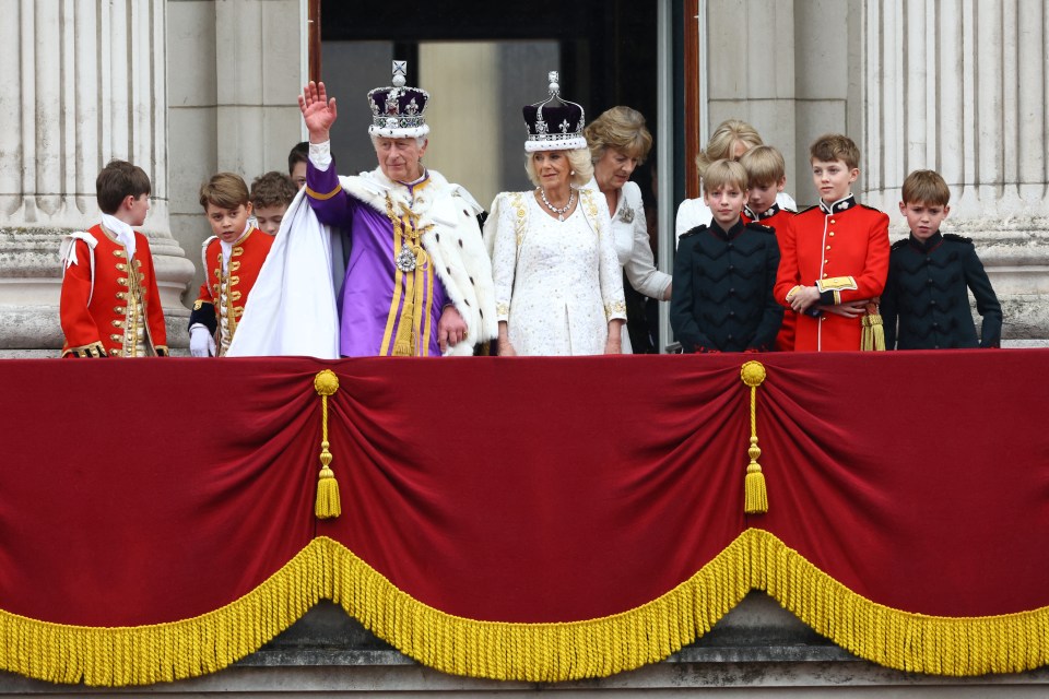 The new King and Queen wave to the royal fans gathered below