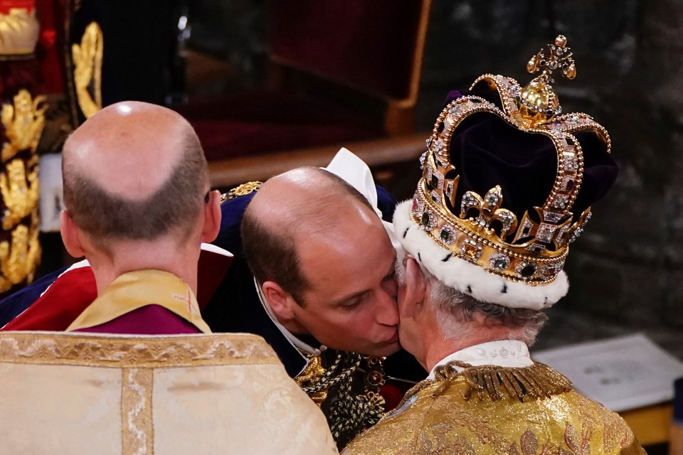 Prince William kisses his father King Charles