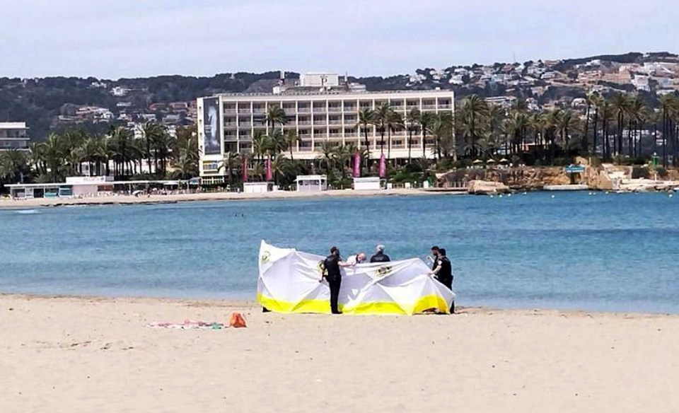 A British woman has died after she collapsed at a popular tourist beach in Spain