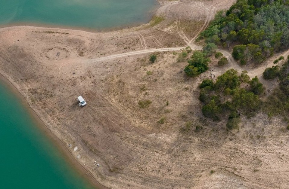 An aerial shot from the banks of the reservoir cops are combing in the hunt for Maddie