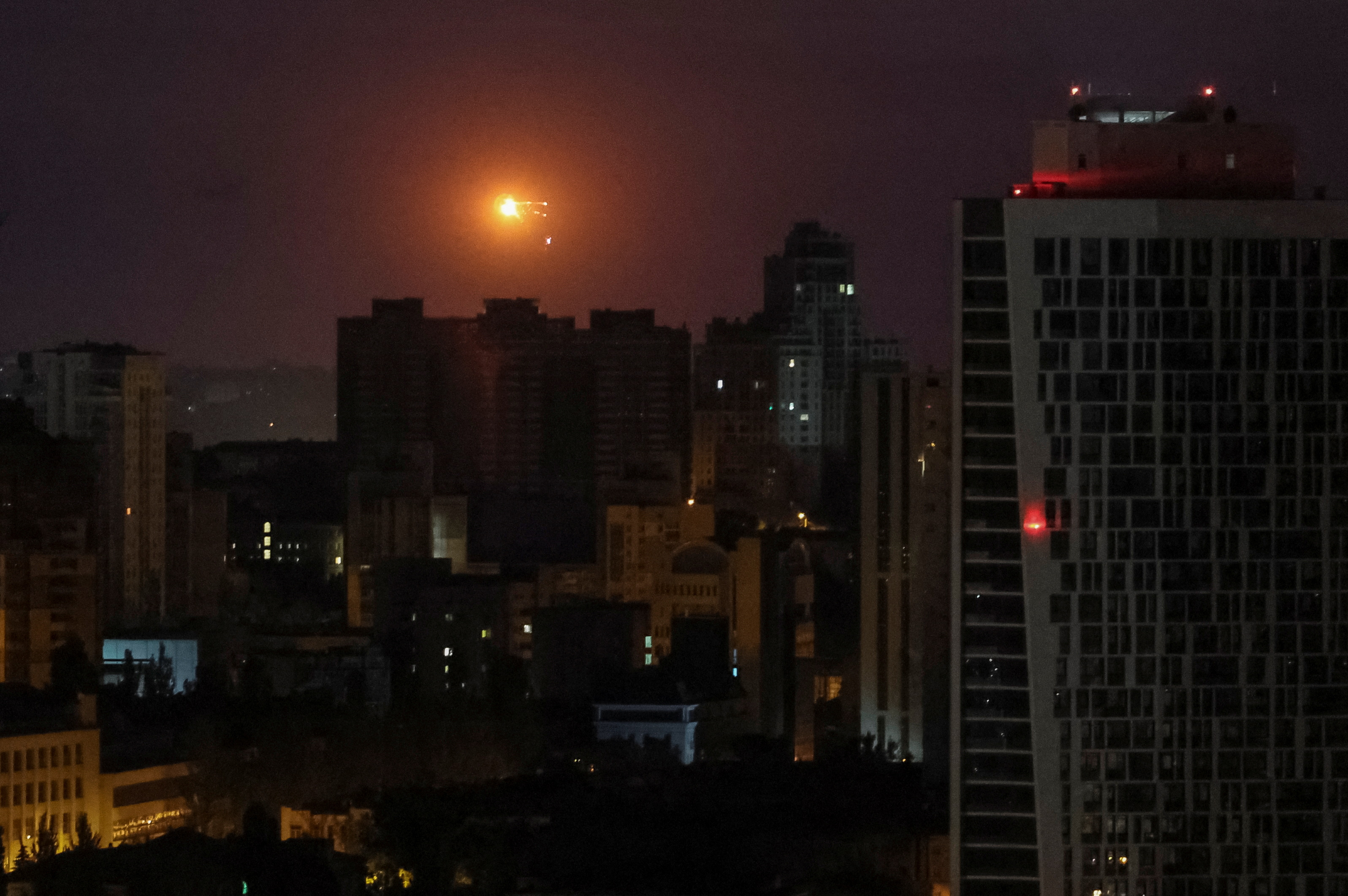 An explosion can be seen over Kyiv during the Russian attack