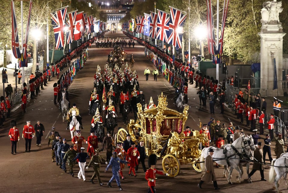 Charles' Gold State Coach was ridden alongside members of the military during a full overnight dress rehearsal for Charles' Coronation Ceremony