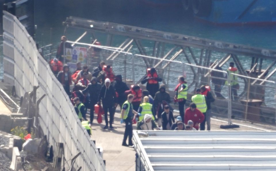 In a two-hour dash, the Ranger raced from the Kent coast to ferry the migrants to Britain - seen here on their arrival at Dover