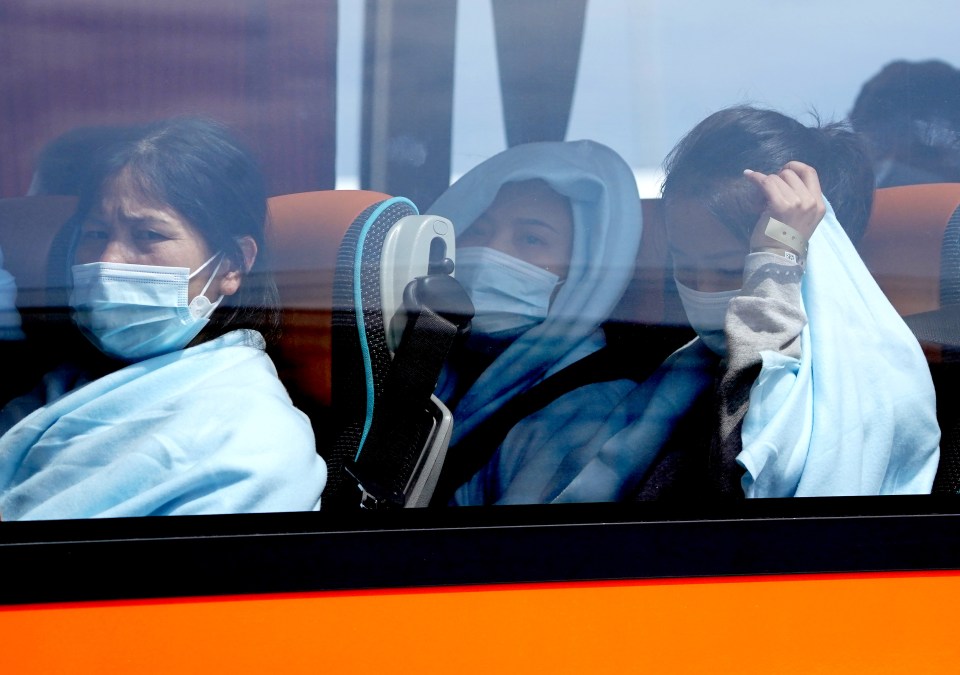 The migrants being transported after landing in Dover