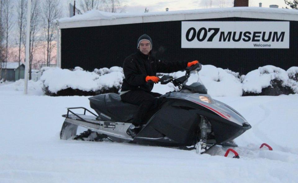 Gunnar James Bond Schafer with his Bond snowmobile at his museum