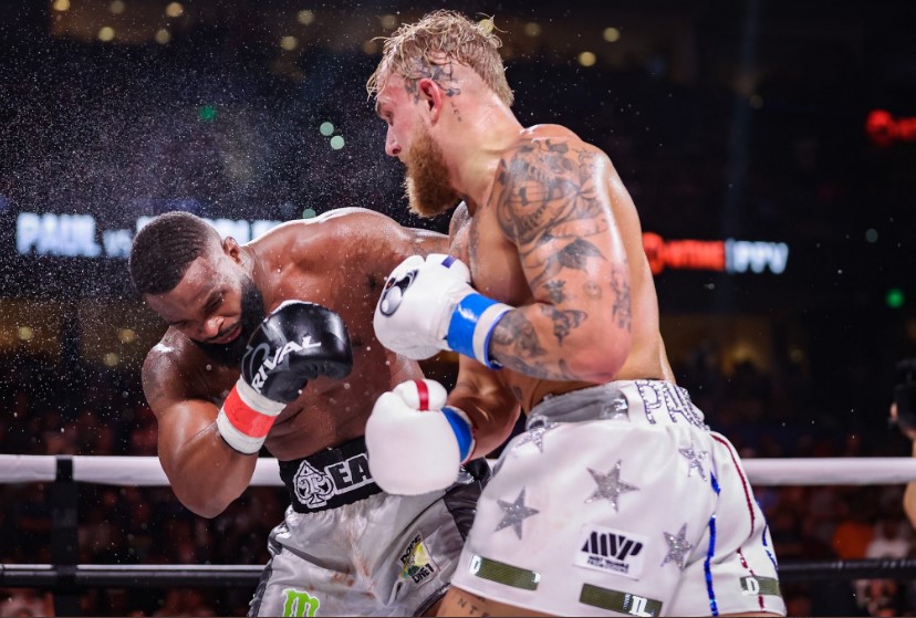 two boxers in a ring with one wearing shorts that say mvp