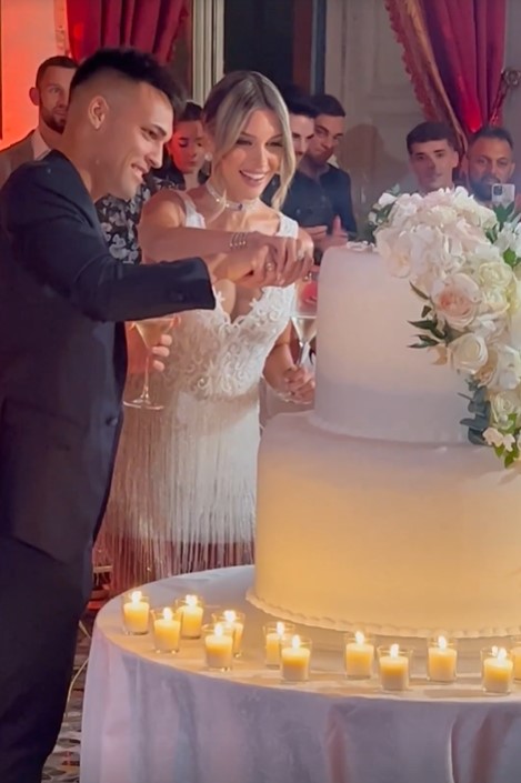 The pair were all smiles as they cut the wedding cake