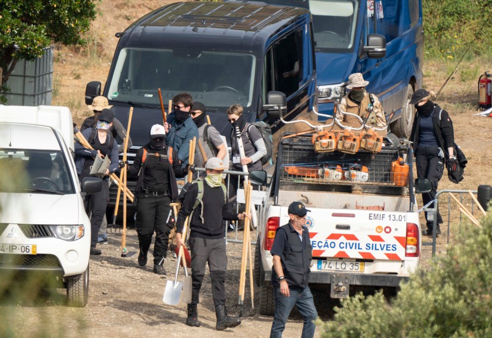 Cops wearing bandanas and holding shovels at the site