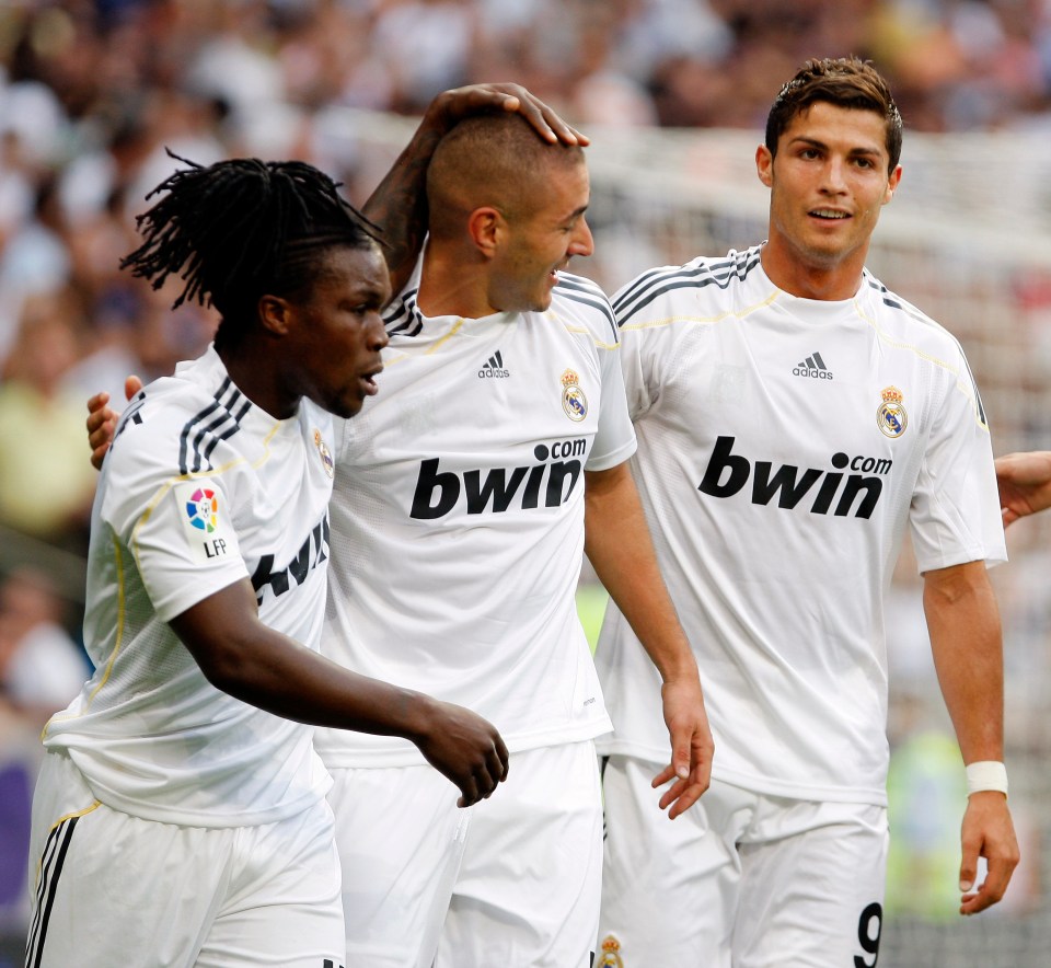 Karim Benzema (C) celebrates a goal with Royston Drenthe (L) and Cristiano Ronaldo