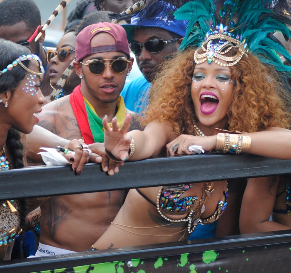 Rihanna and Lewis Hamilton at a parade.