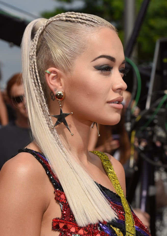 Rita Ora wearing another style that can cause damage, according to hair experts