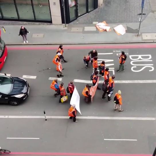 A passerby took matters into his own hands during a Just Stop Oil protest in London today