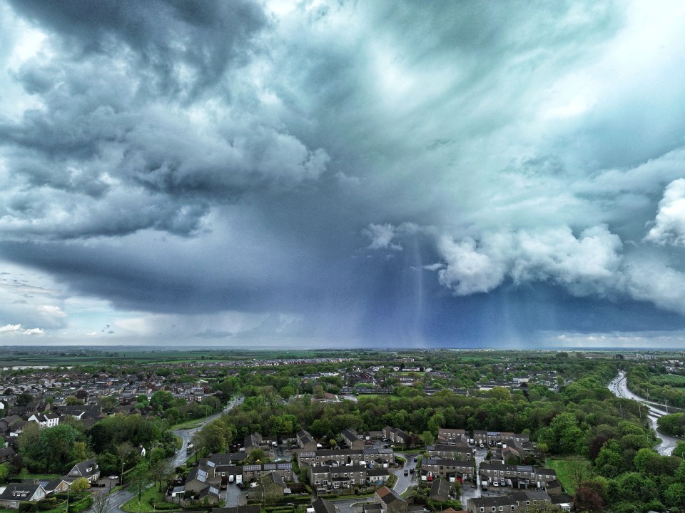 Storm clouds over Peterborough in Cambridgeshire brought torrential rain