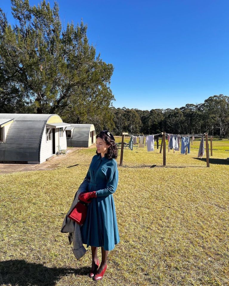 The brunette donned a teal coloured ensemble which consisted of a button up shirt with a matching high waist a-line midi skirt