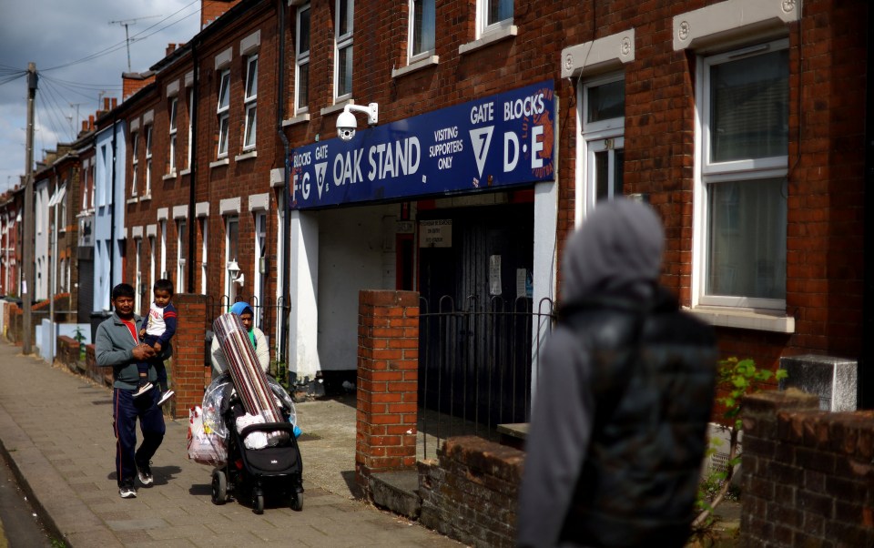 A row of terraced houses has been cut in half by an entrance to Luton Town FC's stadium