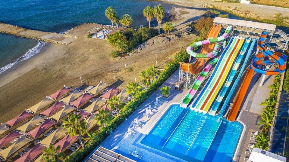 an aerial view of a water park near the beach