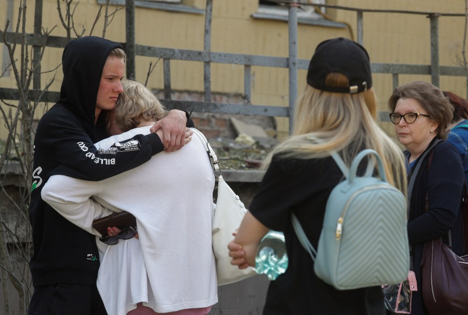 Relatives of the victims seen comforting each other as they reel from the loss